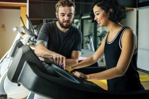 Couple working out together at the gym