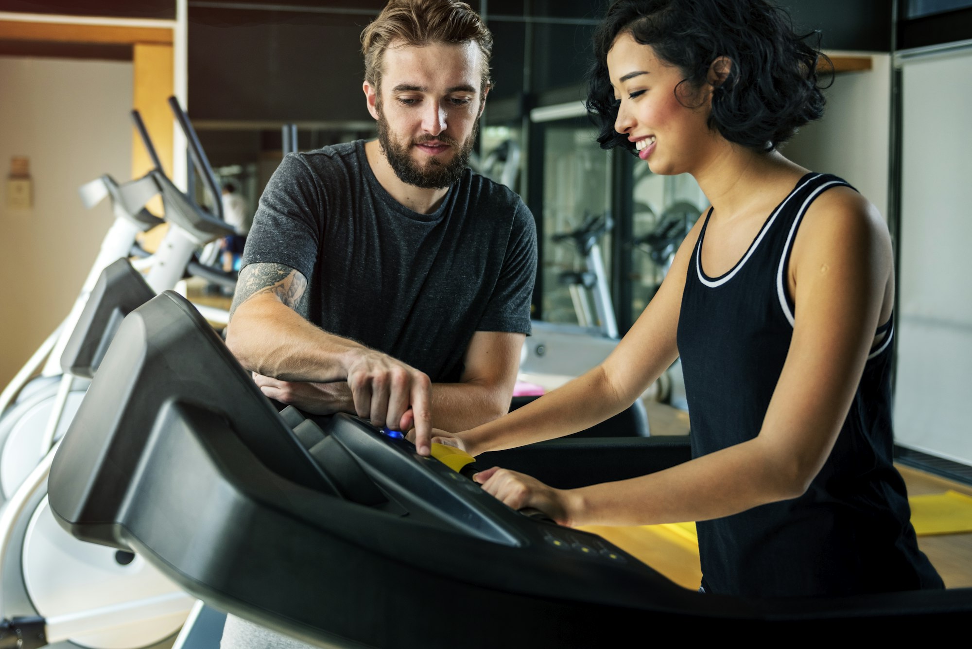 Couple working out together at the gym